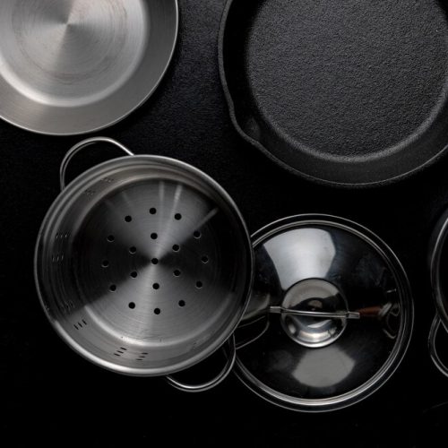 grayscale-overhead-shot-metal-pot-frying-pan-lid_181624-19530